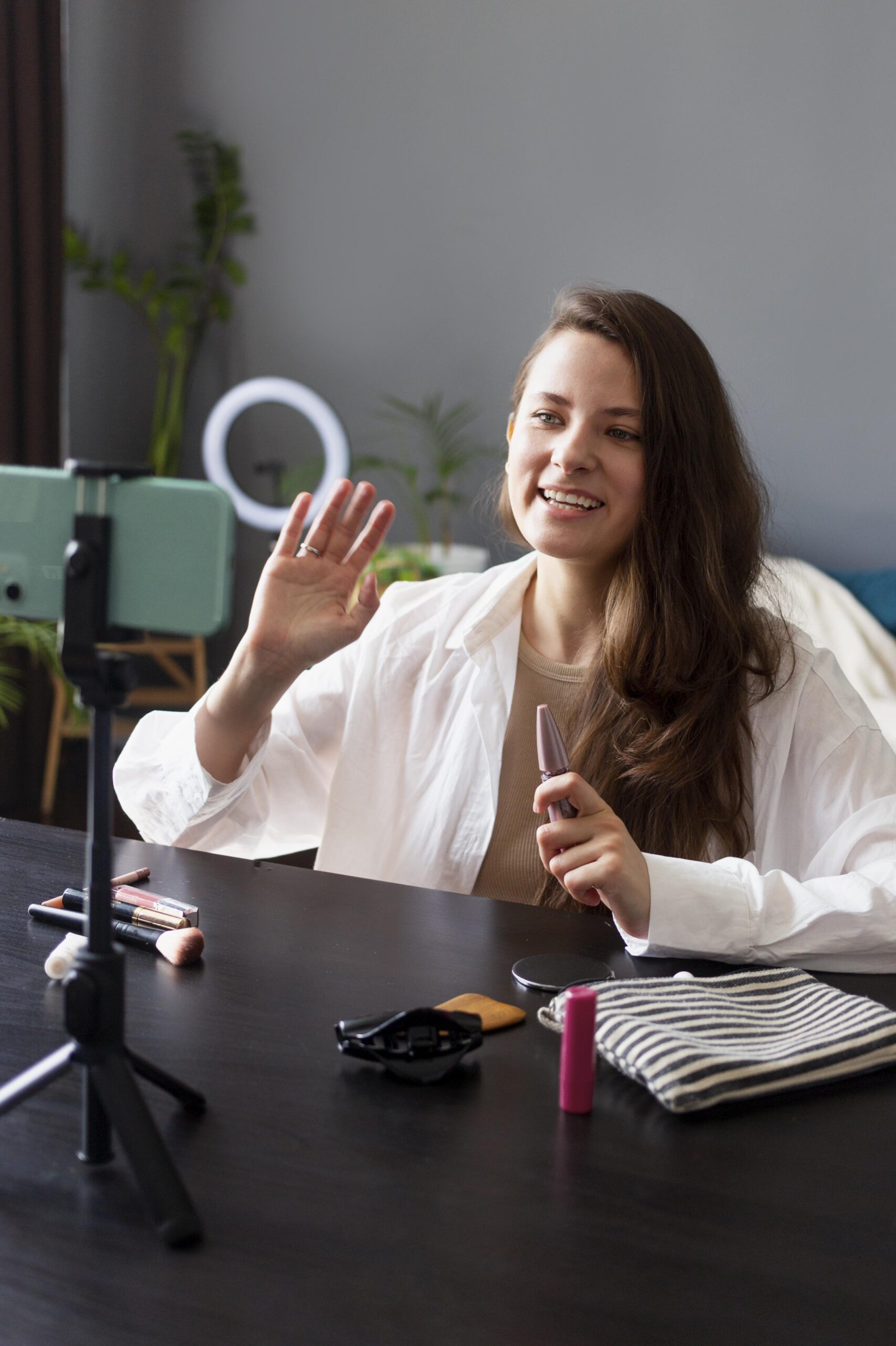 woman-making-beauty-vlog-with-her-smartphone